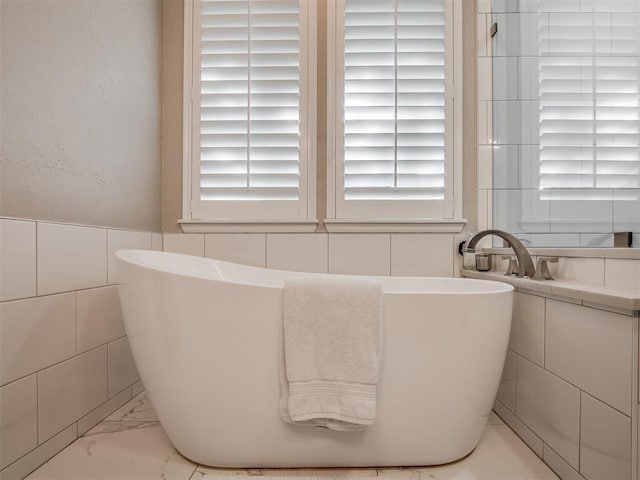3605 Abbotsford, Norman, OK 73072 - full bath with tile walls, a freestanding bath, and marble finish flooring