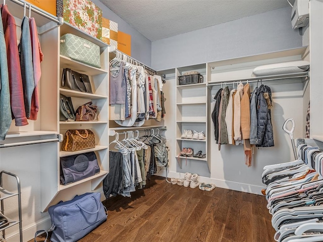 3605 Abbotsford, Norman, OK 73072 - walk in closet featuring wood finished floors and a wall mounted air conditioner