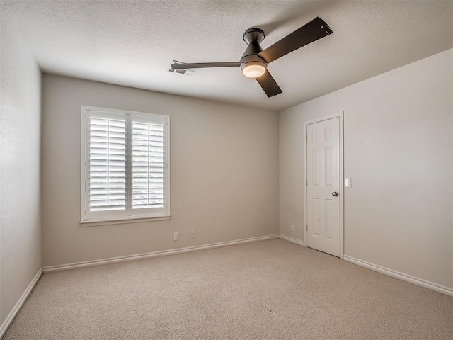 3605 Abbotsford, Norman, OK 73072 - spare room with ceiling fan, carpet, baseboards, and a textured ceiling