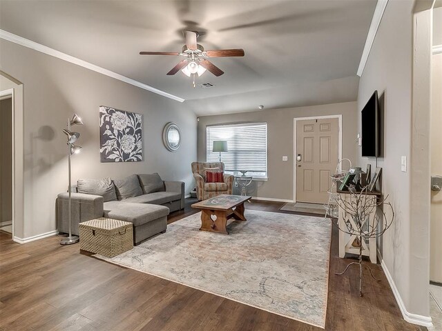 2536 Canyon Creek Dr, Yukon, OK 73099 - living area featuring a ceiling fan, wood finished floors, arched walkways, baseboards, and crown molding