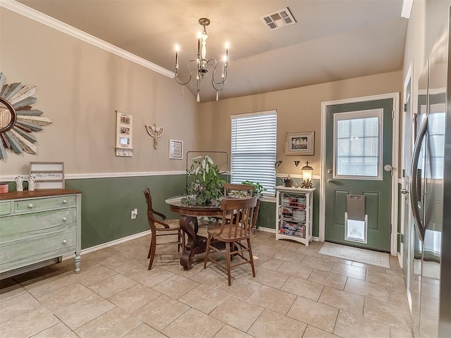 2536 Canyon Creek Dr, Yukon, OK 73099 - dining area with a chandelier, crown molding, and baseboards