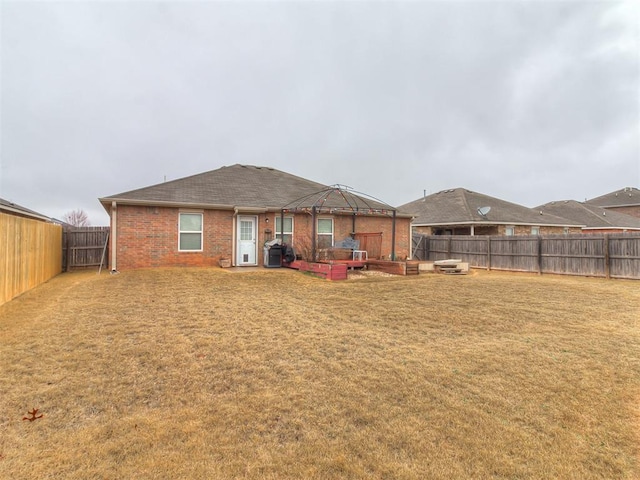 2536 Canyon Creek Dr, Yukon, OK 73099 - back of house featuring a gazebo, brick siding, and roof with shingles