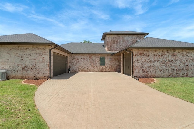 3419 Abby Ln, Newcastle, OK 73065 - view of front facade featuring an attached garage, concrete driveway, a front yard, and brick siding