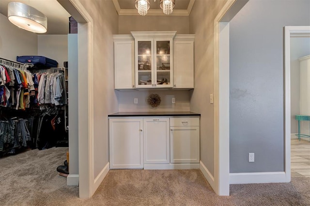 3419 Abby Ln, Newcastle, OK 73065 - bar with light colored carpet, ornamental molding, baseboards, and a chandelier