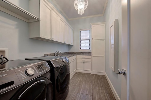 3419 Abby Ln, Newcastle, OK 73065 - washroom featuring independent washer and dryer, cabinet space, crown molding, and a chandelier