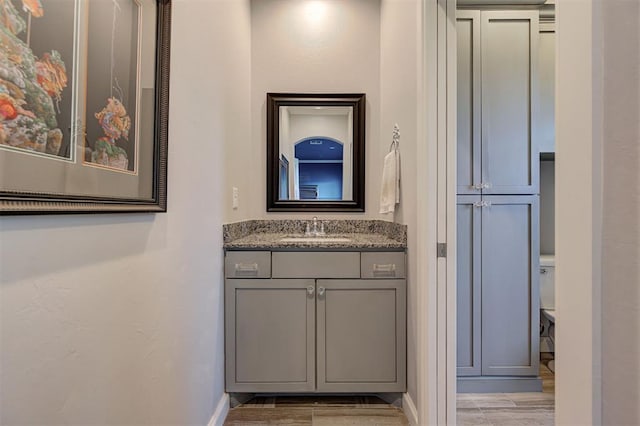 3419 Abby Ln, Newcastle, OK 73065 - bathroom with vanity, wood finished floors, and baseboards