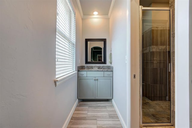 3419 Abby Ln, Newcastle, OK 73065 - hallway featuring baseboards, ornamental molding, and a sink