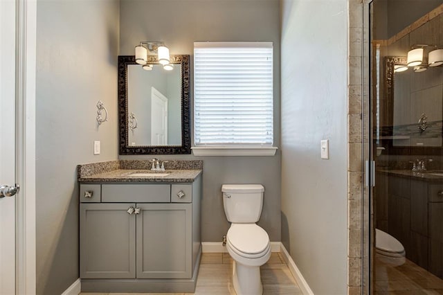 3419 Abby Ln, Newcastle, OK 73065 - full bathroom with toilet, vanity, a stall shower, and baseboards