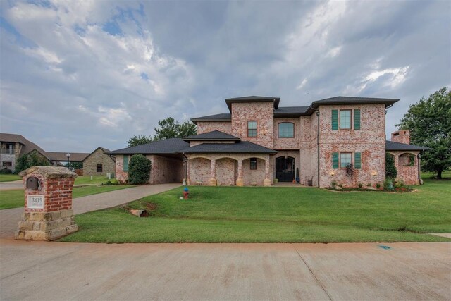 3419 Abby Ln, Newcastle, OK 73065 - view of front of home featuring concrete driveway, a front yard, and brick siding