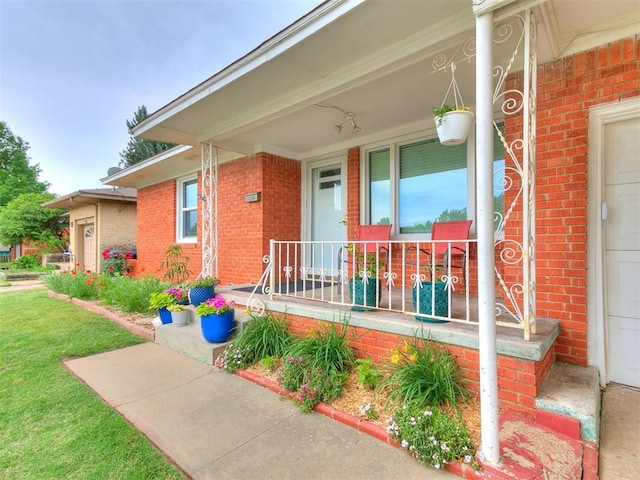 5001 N Independence Ave, Oklahoma City, OK 73112 - view of exterior entry featuring covered porch and brick siding