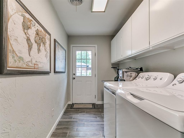 5001 N Independence Ave, Oklahoma City, OK 73112 - laundry area featuring cabinet space, independent washer and dryer, wood finish floors, and baseboards