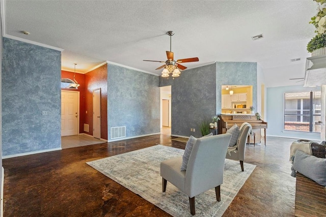 4917 Byron Cir, Yukon, OK 73099 - living room featuring baseboards, ornamental molding, a ceiling fan, and a textured ceiling