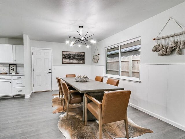 3325 NW 65th St, Oklahoma City, OK 73116 - dining room featuring wood finished floors and a chandelier