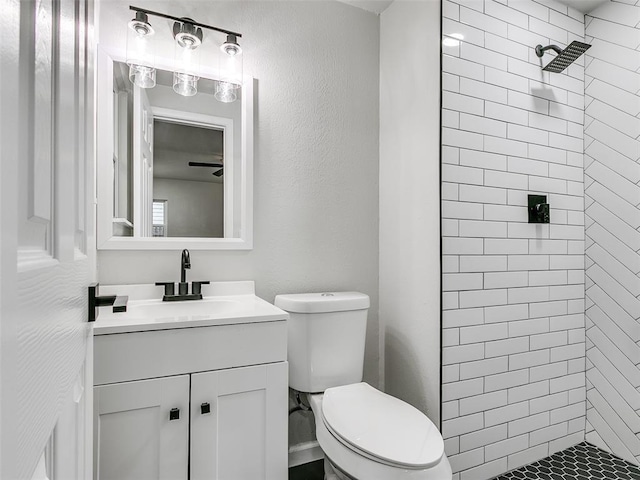 3325 NW 65th St, Oklahoma City, OK 73116 - full bathroom featuring tiled shower, toilet, and vanity