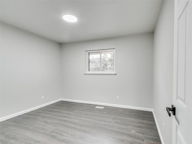 3325 NW 65th St, Oklahoma City, OK 73116 - empty room with wood finished floors and baseboards