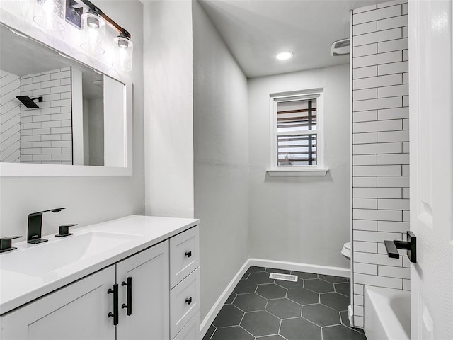 3325 NW 65th St, Oklahoma City, OK 73116 - full bath featuring tile patterned flooring, vanity, baseboards, and recessed lighting