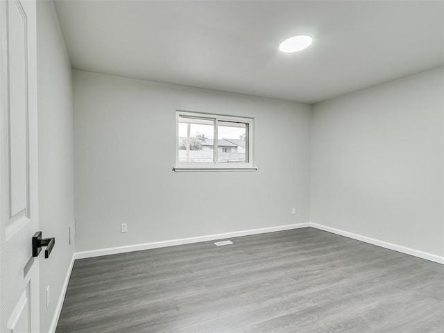 3325 NW 65th St, Oklahoma City, OK 73116 - unfurnished room with wood finished floors and baseboards