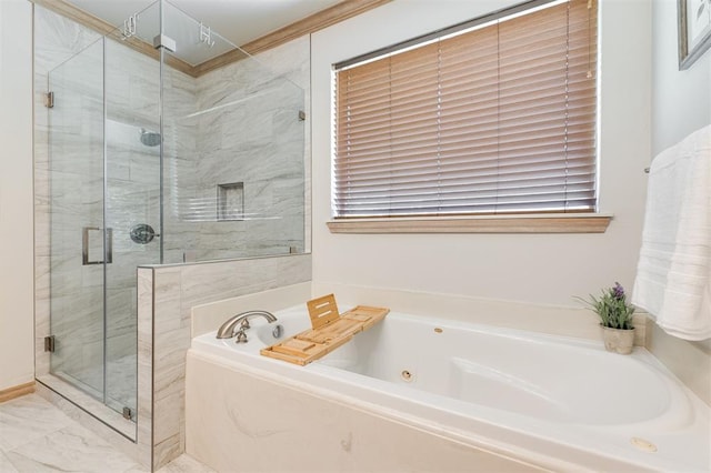 bathroom with a shower stall and a garden tub