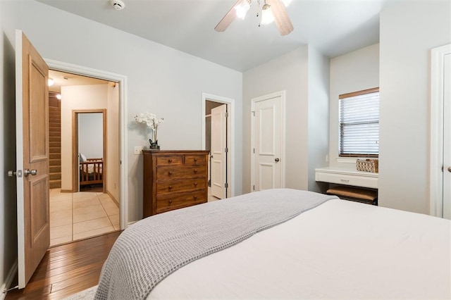 bedroom with wood finished floors and ceiling fan