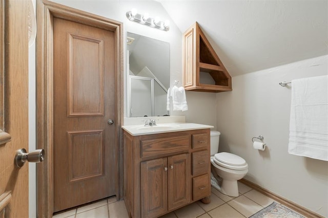 full bath featuring vaulted ceiling, tile patterned flooring, a shower stall, toilet, and vanity