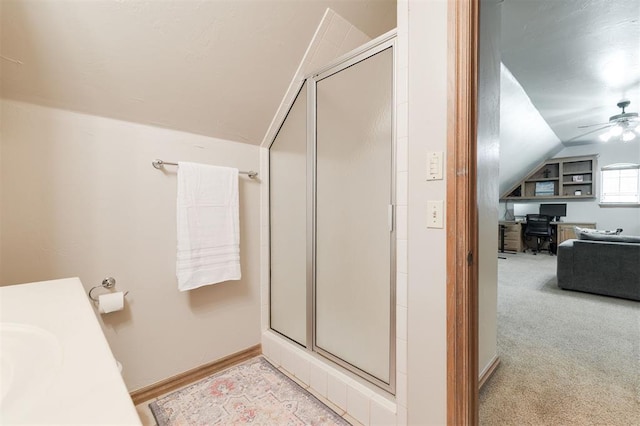 full bath with vaulted ceiling, a shower stall, and ceiling fan