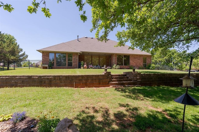 rear view of property featuring brick siding