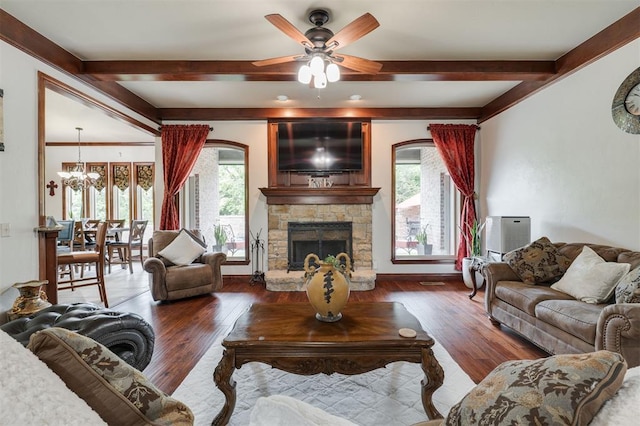 living room featuring beamed ceiling, healthy amount of natural light, hardwood / wood-style flooring, and a chandelier
