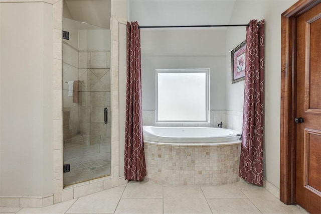 full bath with a garden tub, a shower stall, and tile patterned floors