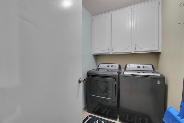 laundry room featuring cabinet space and washer and dryer