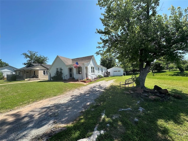 view of front of home with driveway, a front lawn, a garage, and stucco siding