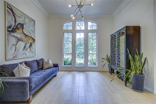 living area featuring a chandelier, crown molding, and baseboards