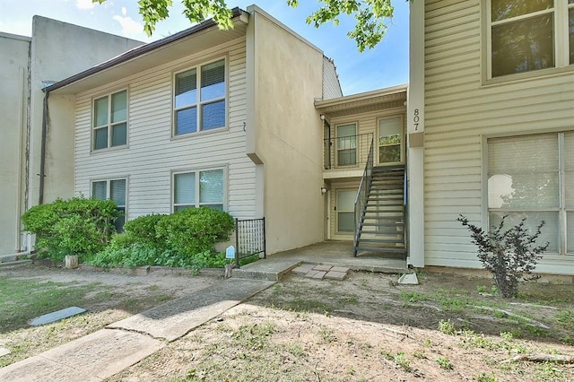 807 Cardinal Creek Blvd Unit C, Norman, OK 73072 - view of front of house with stairway and stucco siding
