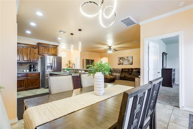 dining room featuring ornamental molding, ceiling fan, recessed lighting, and baseboards