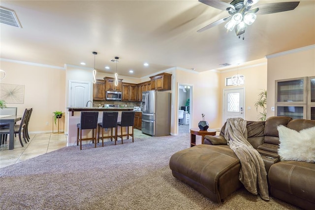 living room featuring recessed lighting, a ceiling fan, baseboards, ornamental molding, and light tile patterned flooring