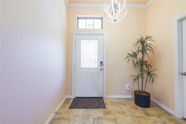 foyer entrance with baseboards, crown molding, stone tile floors, and a chandelier