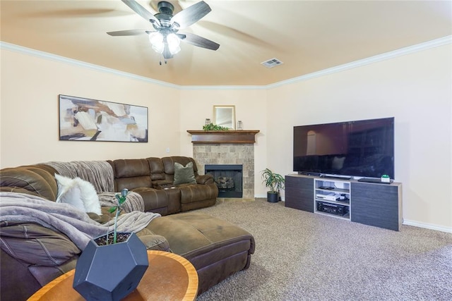 carpeted living area featuring crown molding, ceiling fan, baseboards, and a tile fireplace