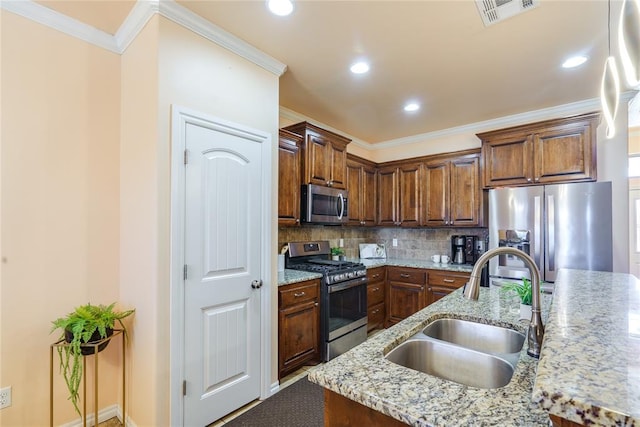 kitchen with stainless steel appliances, a sink, decorative backsplash, ornamental molding, and recessed lighting