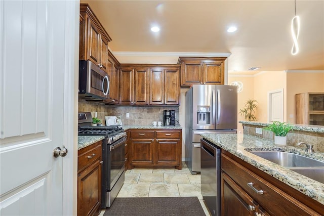 kitchen with stainless steel appliances, crown molding, backsplash, a sink, and light stone counters