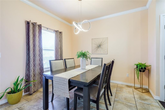 dining space featuring crown molding, baseboards, and light stone finish flooring