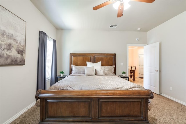 bedroom featuring light carpet, baseboards, and ceiling fan