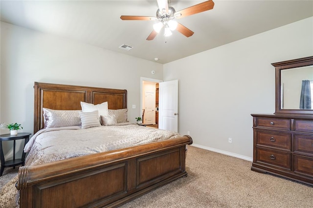 bedroom featuring light carpet, baseboards, and a ceiling fan