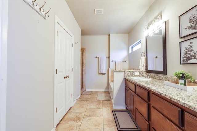 full bathroom with a bath and vanity