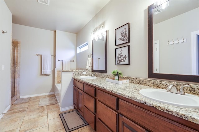 bathroom with a bath, double vanity, baseboards, and a shower