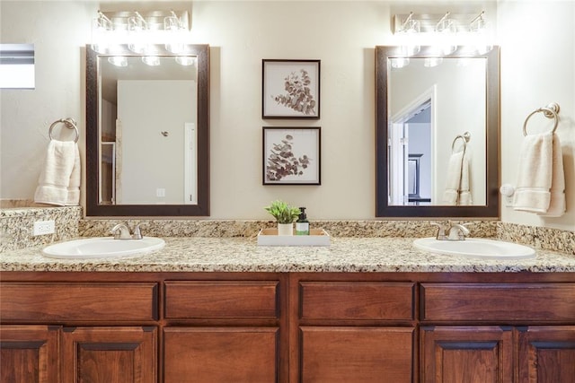 bathroom featuring double vanity
