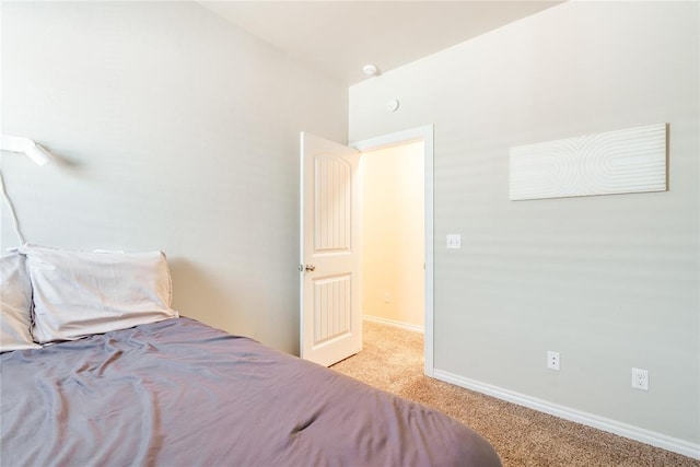 carpeted bedroom with baseboards