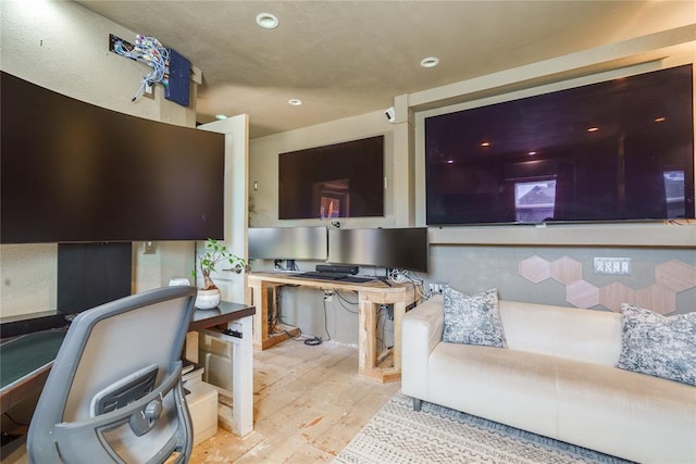 office with wood finished floors and recessed lighting