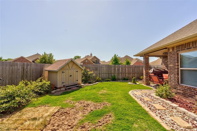 view of yard featuring a shed and an outdoor structure