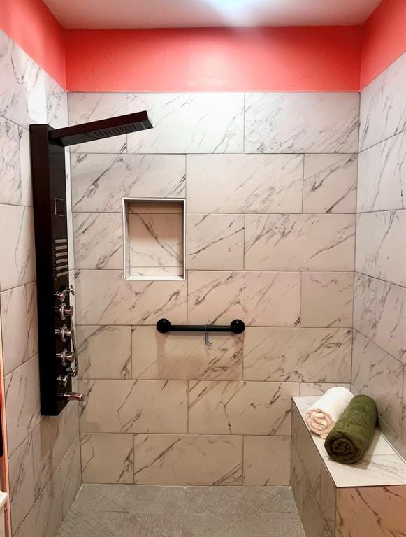 full bathroom with tiled shower