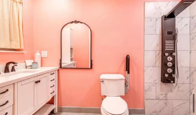 18906 13th St, Shawnee, OK 74801 - bathroom with vanity, toilet, baseboards, and a shower