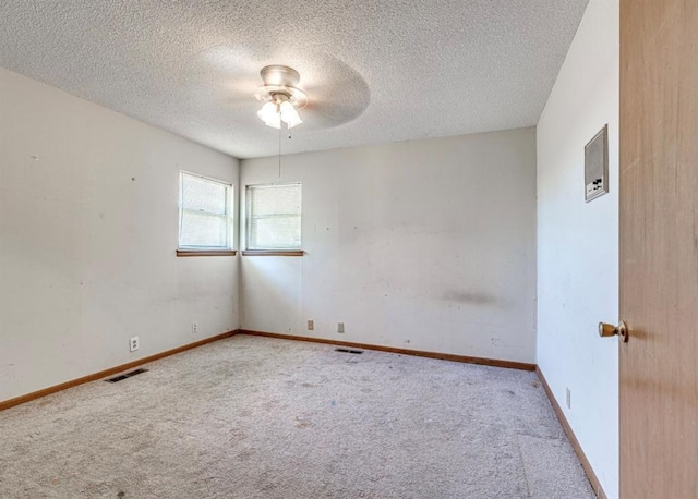 18906 13th St, Shawnee, OK 74801 - unfurnished room with carpet floors, a ceiling fan, a textured ceiling, and baseboards